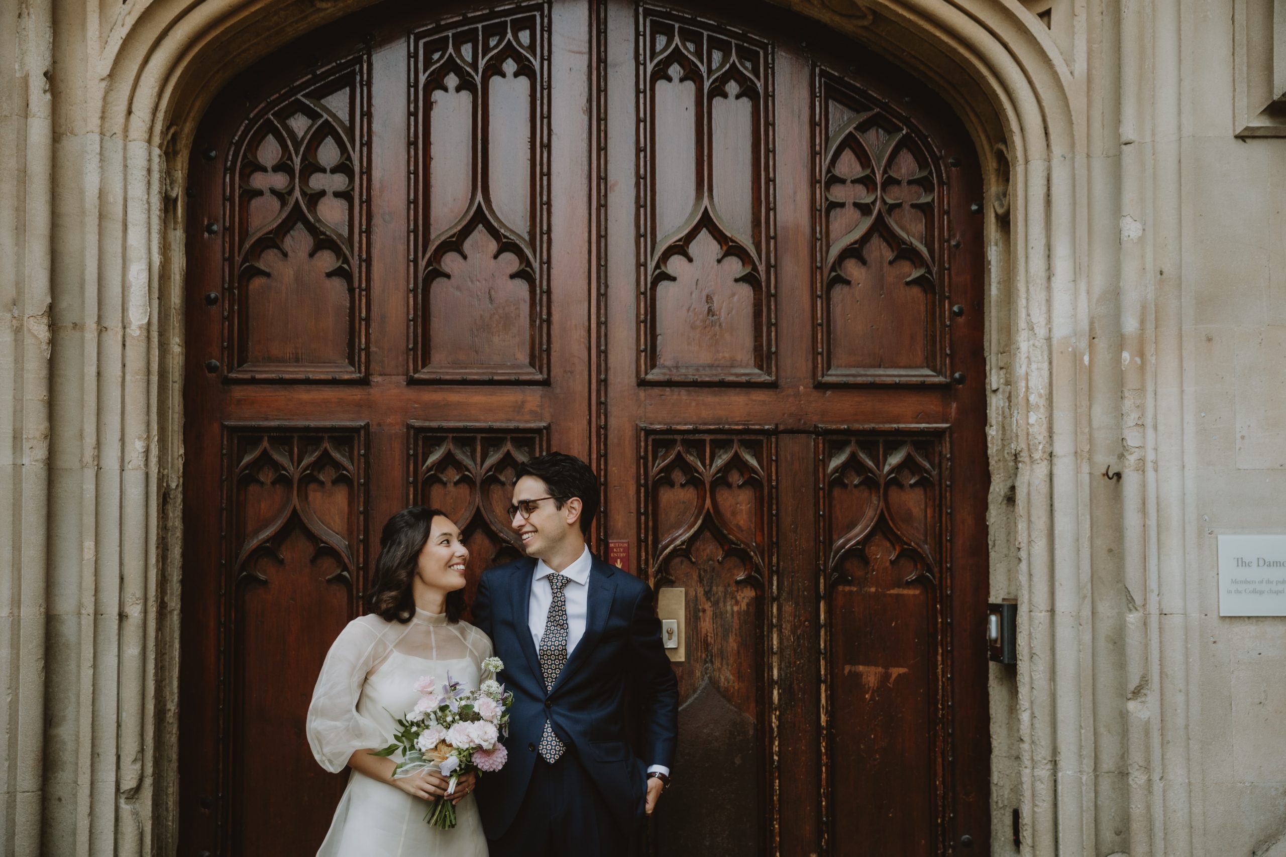 Wedding couple bride and groom in front of an old door